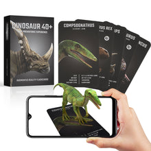 Dinosaur 4D+ augmented reality flashcards with smartphone app and hand holding a phone displaying a dinosaur.