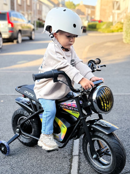 Littletrax 350W Kids Electric Bike Child riding a small motorcycle on a street with a helmet on
