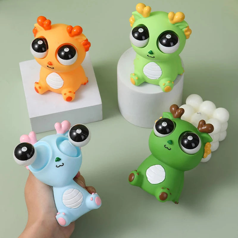 Four colorful toy figures on a light green background