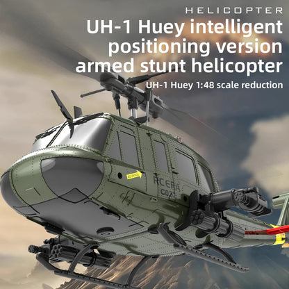 Model helicopter with text indicating it is a UH-1 Huey intelligent positioning version armed stunt helicopter.
