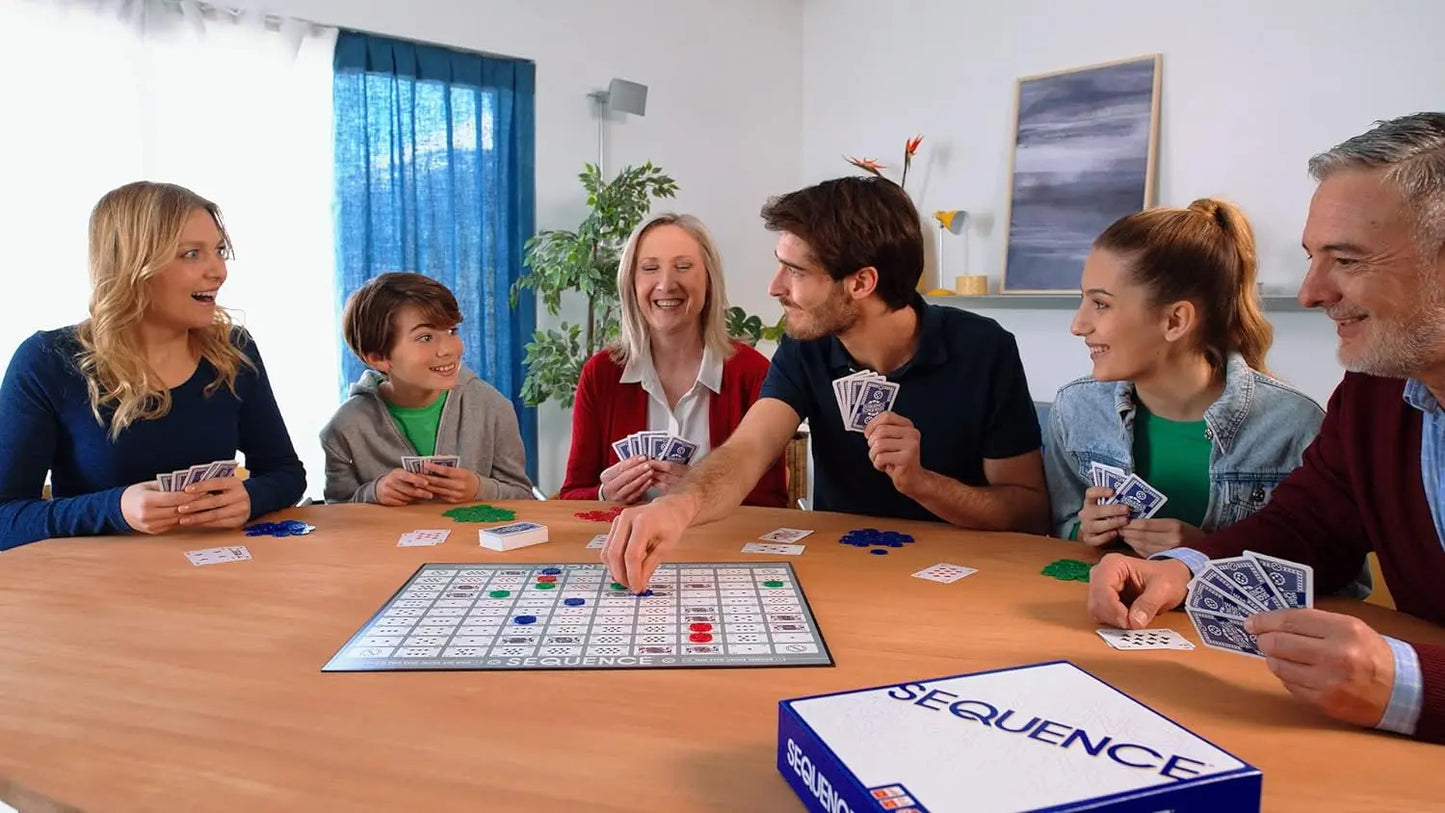 Family playing Sequence board game together at a table