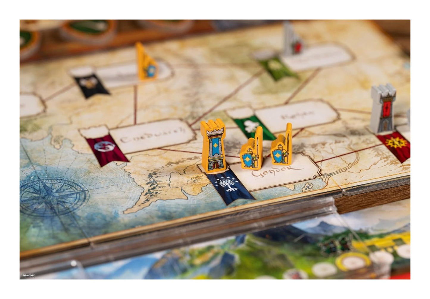 The Lord of the Rings: Duel for Middle-Earth Strategy Board Game Board game piece on a map with flags and buildings