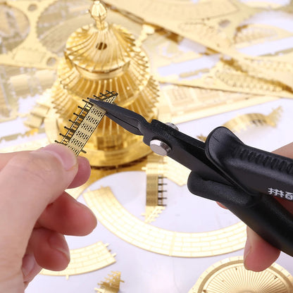 Black scissors cutting gold paper with decorative background