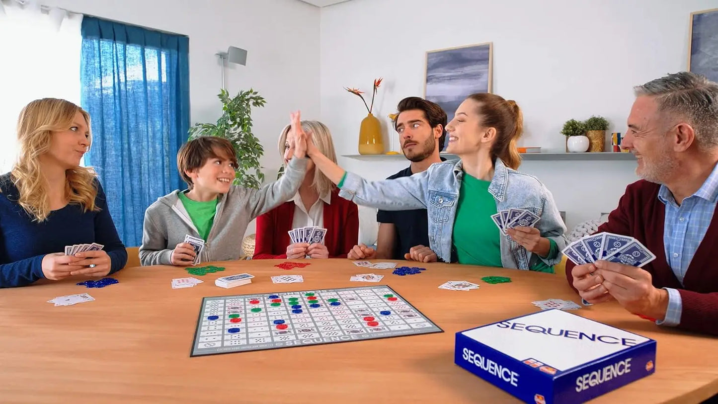 Family playing Sequence board game together in a living room.