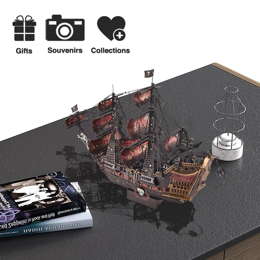 Pirate ship model on a dark surface with books and a small sculpture.