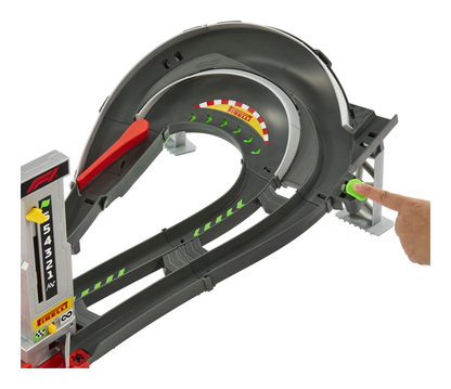 Hot Wheels Racing Grand Prix Racing Circuit Track Set  Toy track set with a curved track and a hand placing a green car on it