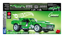 Hot Wheels Custom '68 Camaro toy car set packaging with green car and branding.