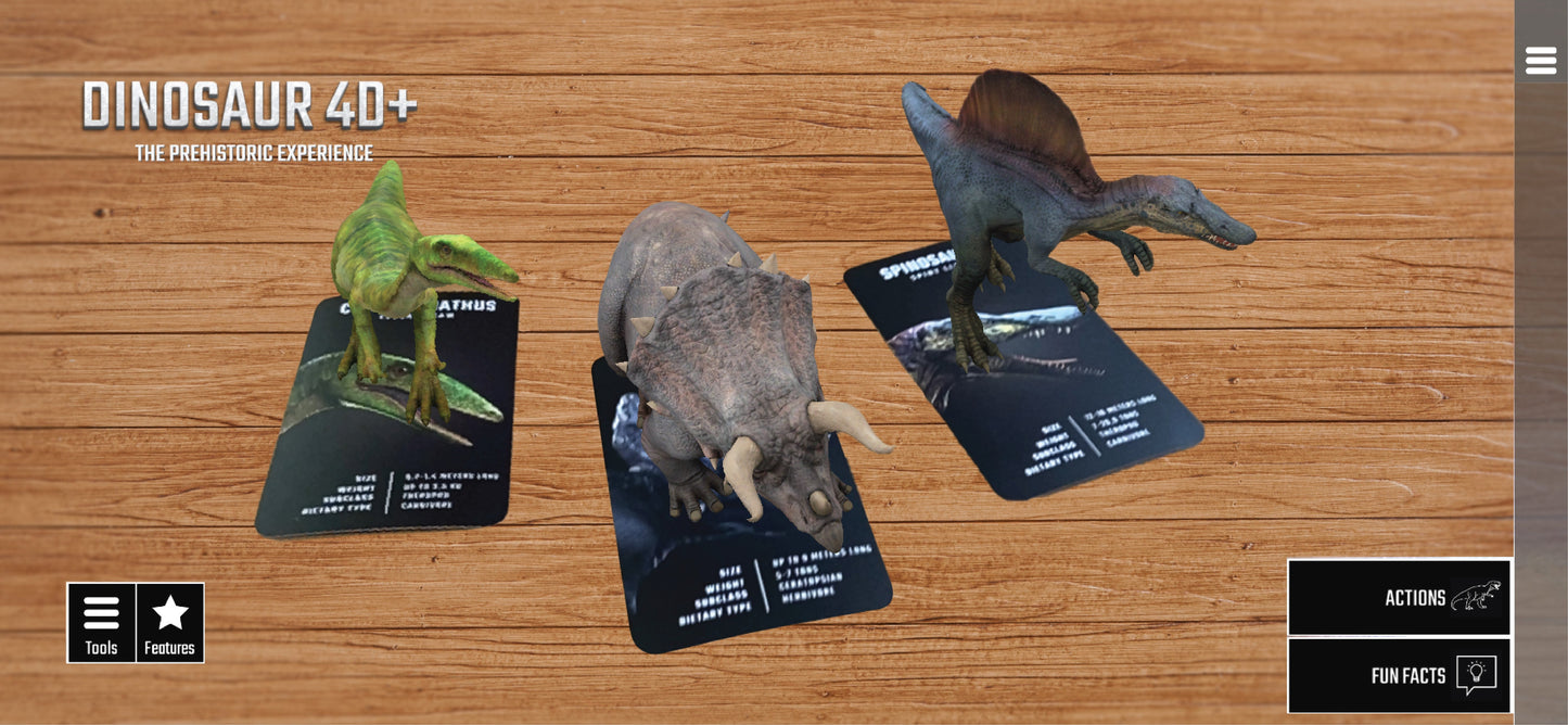 Dinosaur 4D+ Augmented Reality Cards Three dinosaur figurines on cards with 'Dinosaur 4D+' branding on a wooden surface.