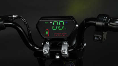 Digital display on a motorcycle handlebar with green and red text against a dark background