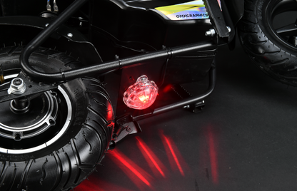 Close-up of a toy car's undercarriage with visible suspension and red light on a dark background