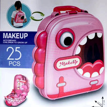 Pink makeup case with monster design and smaller makeup set on a white background