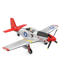 A red, white, and blue RC plane model resembling a WWII fighter aircraft with a propeller in front.