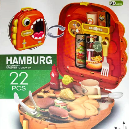 Toy hamburger set with a red lunchbox, various food items, and a small screen displaying images of hamburgers.