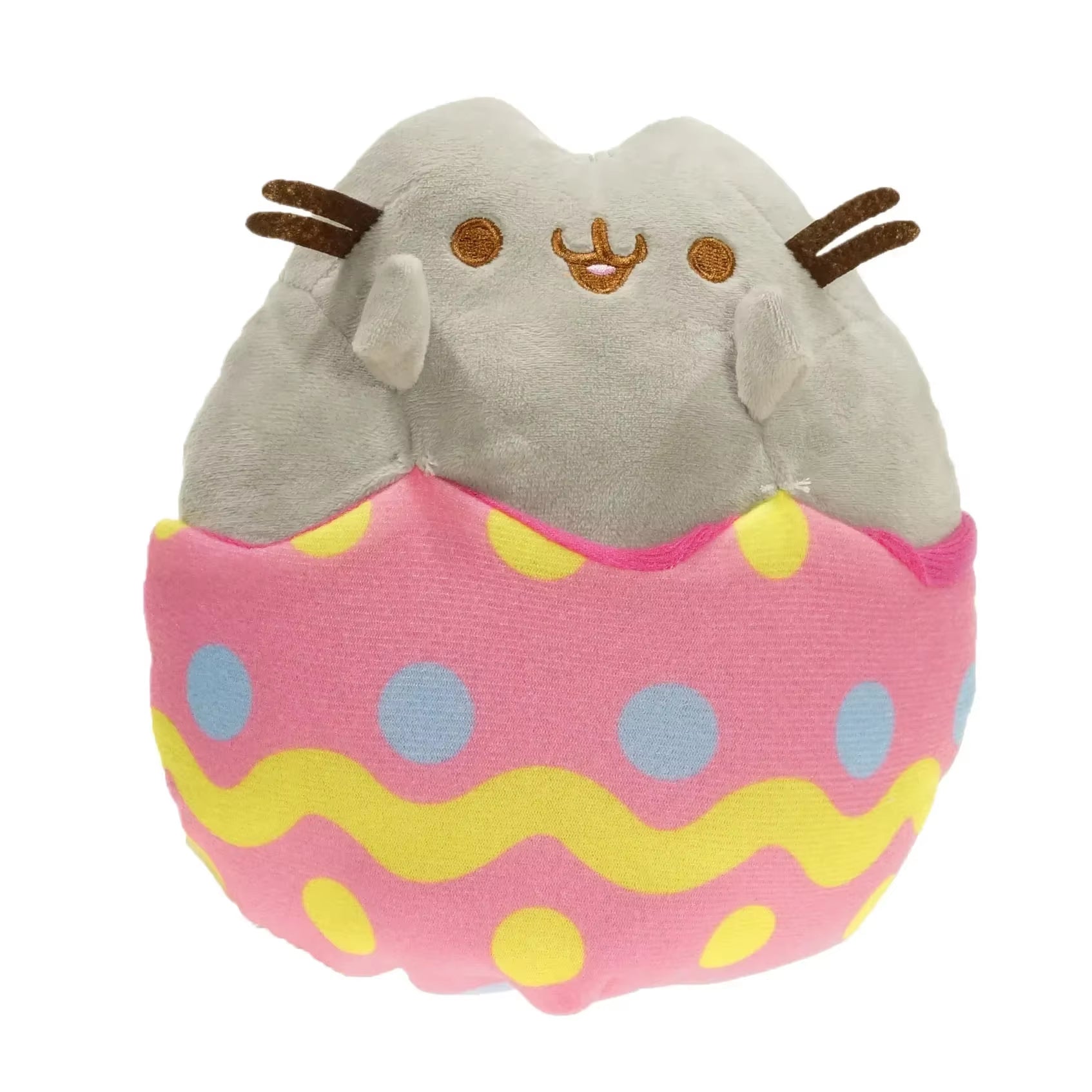 Plush toy resembling a cat in an Easter egg with pink and yellow pattern on a white background