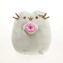 Plush toy resembling a cat with antlers and a donut on a white background