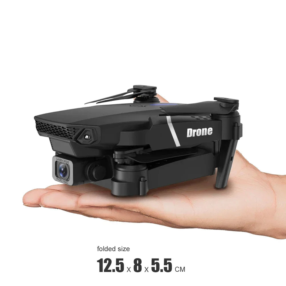 Small black drone held in a hand with text about its size and ease of use.