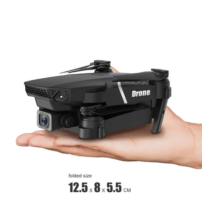 Small black drone held in a hand with text about its size and ease of use.