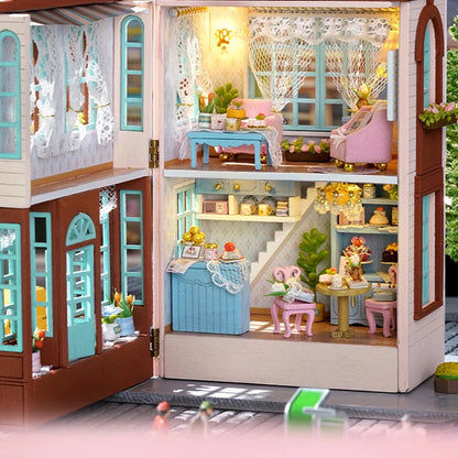 Detailed dollhouse with multiple rooms and furniture