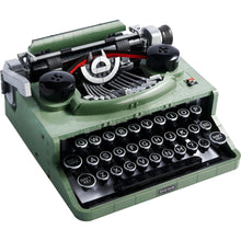 A collectible retro display model of a green typewriter made from building blocks, with realistic typing action and intricate details.