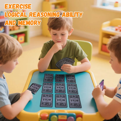 Children playing with educational cards at a table in a classroom setting.