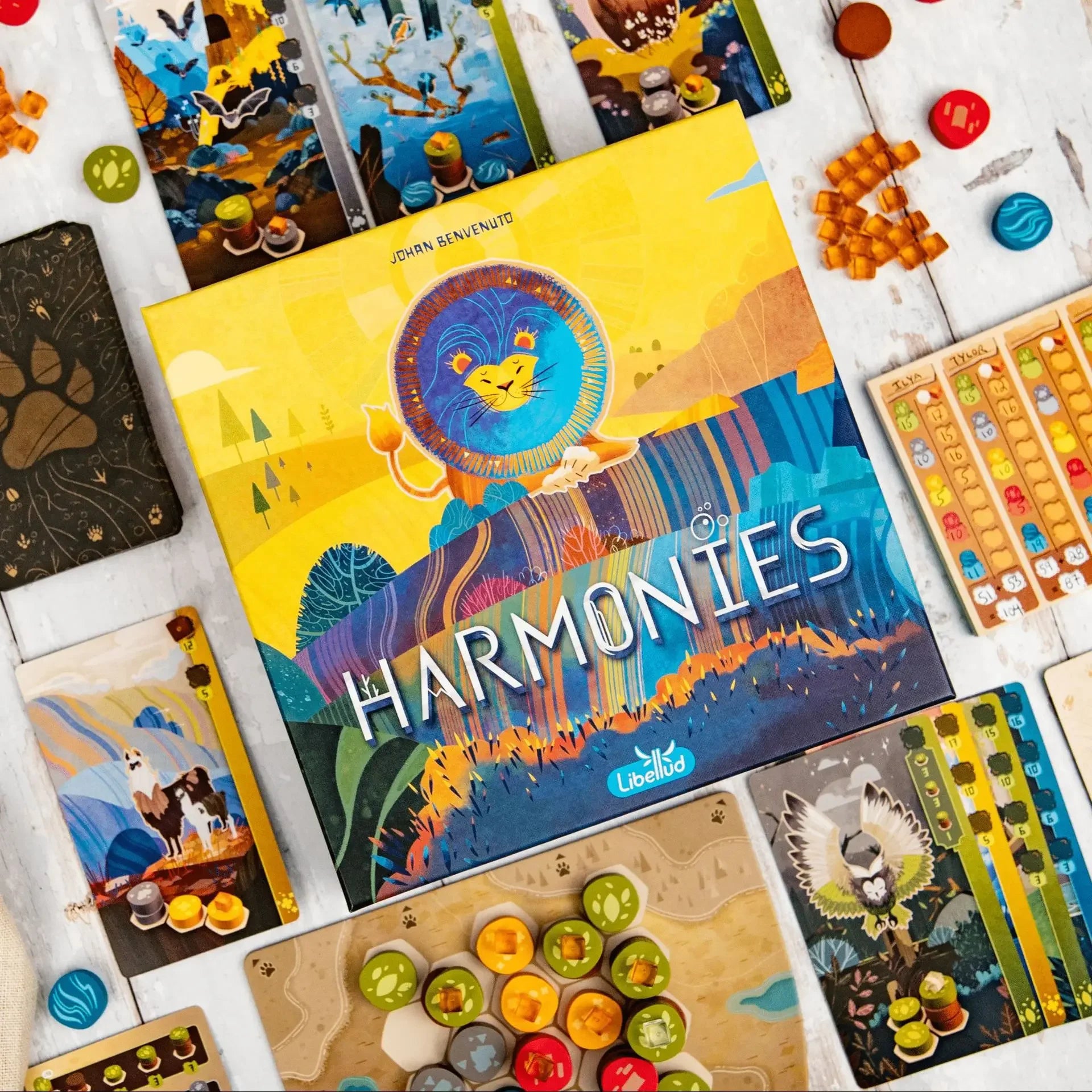 Board game 'Harmonies' by Llambly with colorful components on a white surface