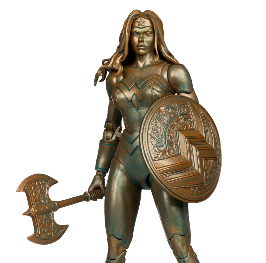 Bronze statue of a warrior woman holding a shield and axe on a white background