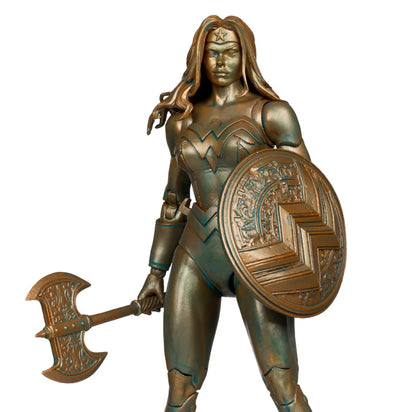 Bronze statue of a warrior woman holding a shield and axe on a white background