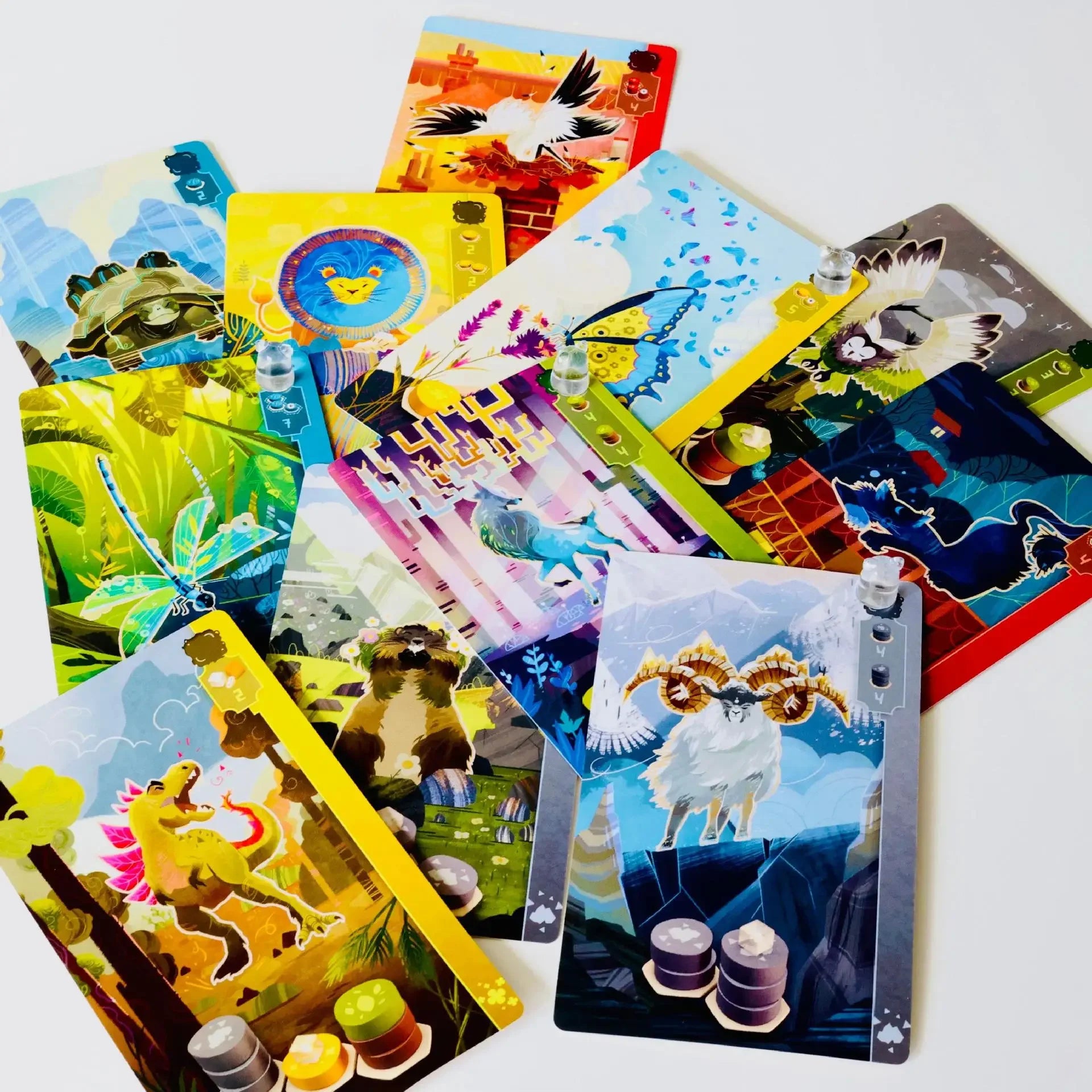 Collection of colorful trading cards with various designs on a white background