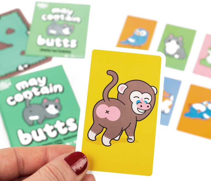 May Contain Butts | Hilarious Animal Matching Card Game for Kids & Families Colorful card game cards with cartoon animals and text, held by a hand.