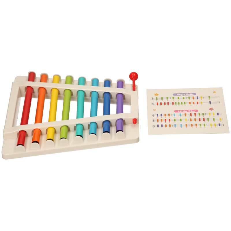 Colorful xylophone toy with a music chart on a white background
