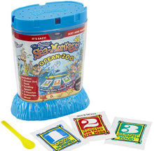 Sea Monkeys Ocean Zoo kit with blue container, cards, and spoon on a white background
