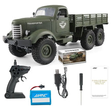 A green JJRC Q60 Military Transporter Truck RC car with a remote control, battery, and USB charging cable.